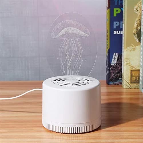 3D Mosquito Killer Lamp (USB) – on a desk beside books